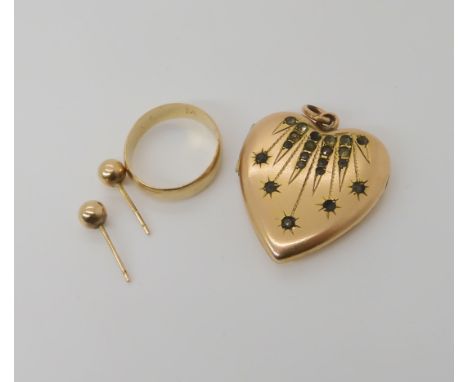 A 9ct wedding ring L1/2, stud earrings weight together 2.5gms, and a rolled gold, gem set heart shaped locket Condition Repor