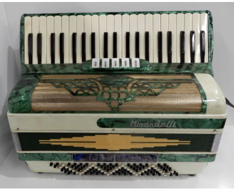 A Mirandelli 41 key 120 bass piano accordion featuring 5 voices: viola, musette, master, bandon and bassoon together with a c