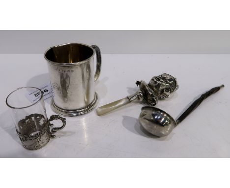 A lot comprising a silver christening mug Birmingham 1919, a white metal and mother of pearl baby rattle, a toddy ladle and a