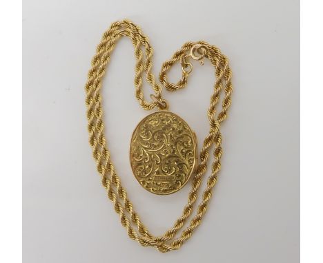 A 9ct gold engraved locket with full hallmarks for Birmingham 1857, dimensions 3.2cm x 2.1cm, with a 9ct rope chain length 40