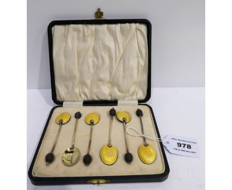 A cased set of six silver gilt and enamel coffee bean spoons Condition Report: Available upon request