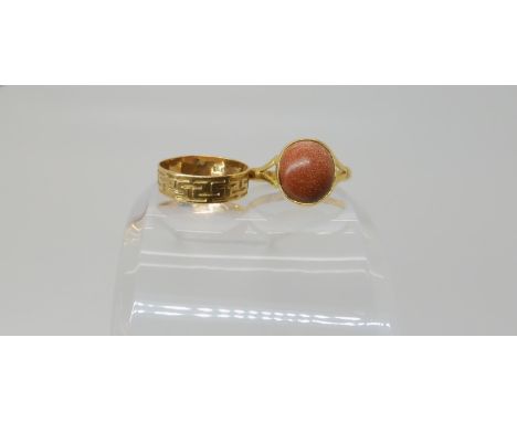 An 18ct gold Greek key pattern wedding ring, size P, a bright yellow metal ring set with a goldstone, the inner shank stamped