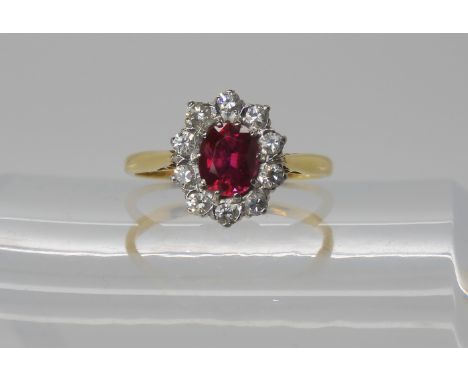 An 18ct gold diamond and faux ruby ring, size L1/2, weight 2.6gms Condition Report: Available upon request