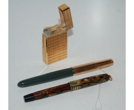 A yellow-metal Dupont lighter and two fountain pens (3) Condition Report: Available upon request