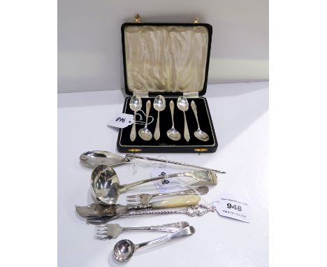  A lot comprising seven pieces of assorted silver cutlery, ladle, butter knife etc. and a cased set of six silver coffee spoo