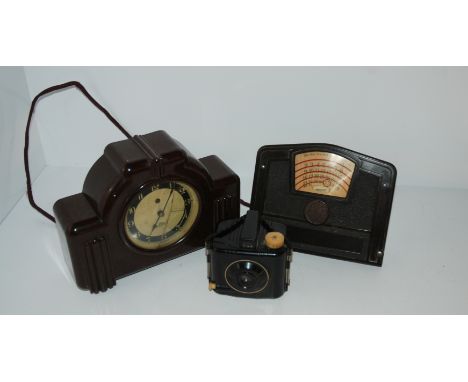 A Bakelite mantle clock, Bakelite desk calendar and Baby Brownie (3) Condition Report: Available upon request