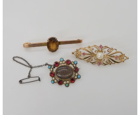 A 9ct pearl and ruby brooch, a plaited hair mourning brooch set with turquoise pearls and red gems, and a citrine bar brooch,