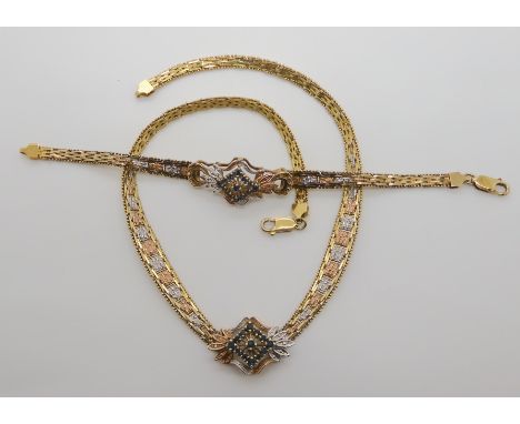 A gold plated silver, gem set necklace and bracelet Condition Report: Not available for this lot