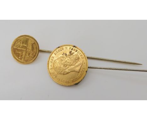 A Peruvian gold coin diameter 1.4cm, and a gold Prussian coin diameter 1.9cm, both mounted onto stick pins, weight combined 6