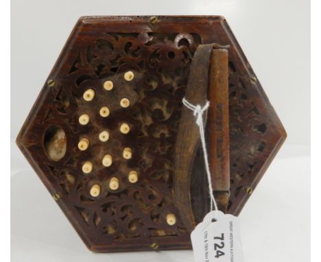 A Lachenal 31 button 6 fold bellows concertina with stamp "English Make Trade Mark" and a carved representation of a concerti