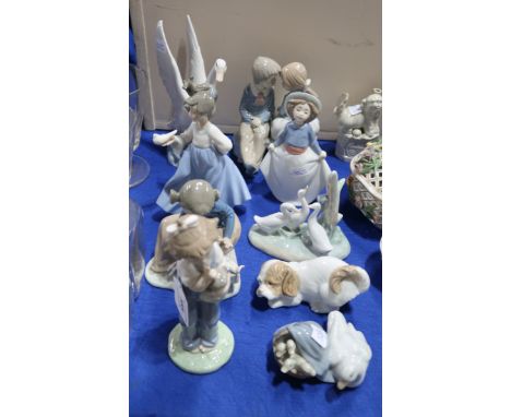 A collection of Nao figures of children and animals and a Lladro duck and ducklings Condition Report: All in nice condition, 