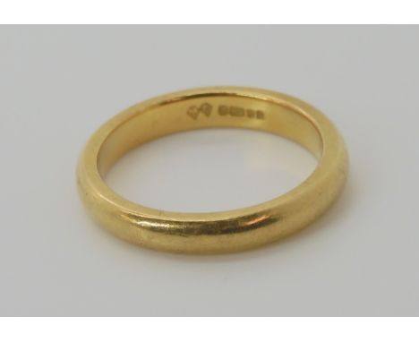 An 18ct gold wedding ring, size L1/2, weight 4.5gms Condition Report: Available upon request