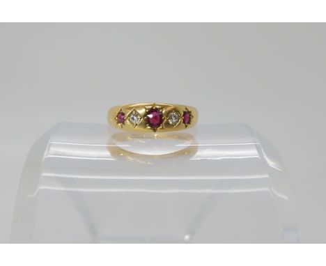 An 18ct gold red gem and diamond ring, size M1/2, weight 3.8gms Condition Report: Available upon request