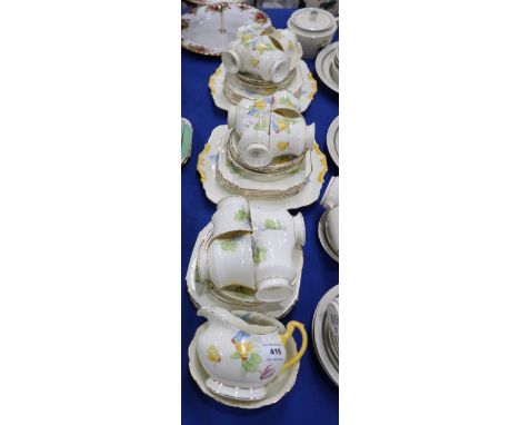 A Paragon Cyclamen pattern teaset comprising twelve cups, saucers and plates, two cake plates, milk jug and sugar bowl Condit