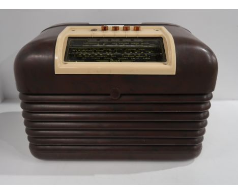 A Bush bakelite push button radio (af) Condition Report: Available upon request