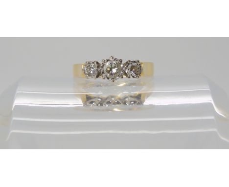 An 18ct gold three stone diamond ring set with estimated approx 0.30cts, finger size L1/2, weight 3.5gms Condition Report: Av