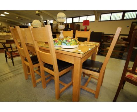 Light wood extending dining table and six chairs