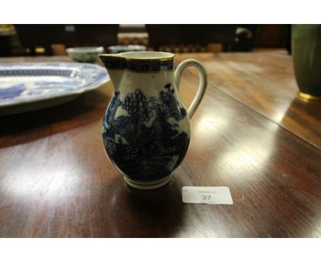 18th Century Caughley 'Willow' pattern blue and white porcelain Sparrow Beak cream jug, with gilded rim, c. 1770, 10cm high
