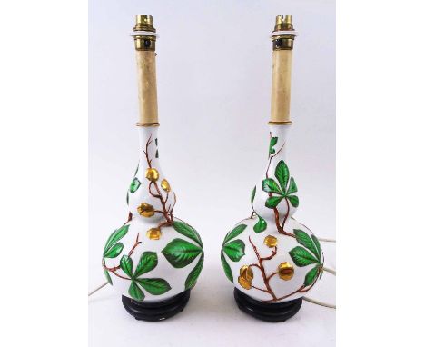 TABLE LAMPS, a pair, Oriental style, ceramic with raised foliate detail, 48cm H max, plus two shades. (2)