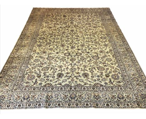 FINE SIGNED KASHAN CARPET, 400cm x 297cm, all over palmette and scrolling vine design, on a jade field within complimentary b