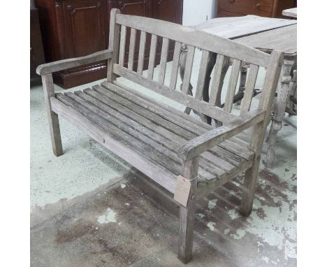 GARDEN BENCH, weathered teak, of slatted construction, 125cm W.