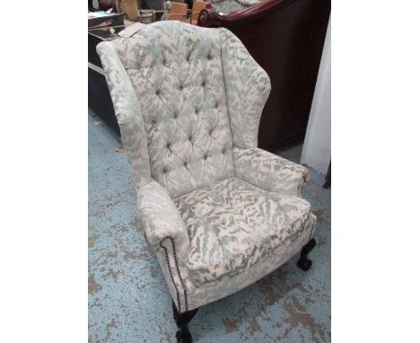 WINGBACK ARMCHAIR, in patterned fabric with button back and claw and ball feet, 85cm W x 122cm H.