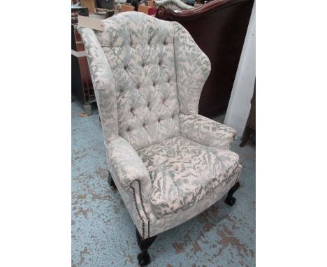 WINGBACK ARMCHAIR, in patterned fabric with button back and claw and ball feet, 85cm W x 122cm H.