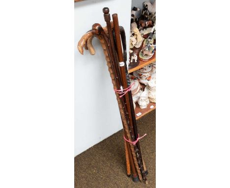 A Shooting Stick, together with various other canes and walking sticks, including hawthorne and African examples (9)