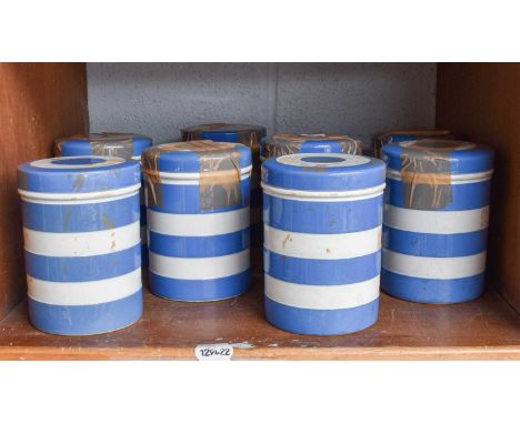 T G Green Cornish Ware, eight blue banded storage jars, of cylindrical form (one shelf)Provenance: A Private Collection in th