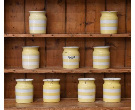 T G Green Cornish Ware, eight yellow banded storage jars and covers, including one inscribed "Flour", together with another (