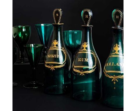 A Set of Three George III Emerald Glass Decanters, labelled in gilt for "Hollands", "Shrub" and "Rum" together with a quantit