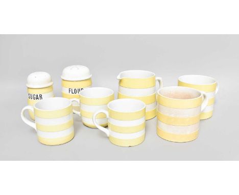 T G Green Cornish Ware, yellow banded "Flour" and "Sugar" shakers, five assorted mugs and a jug (one tray)Provenance: A Priva