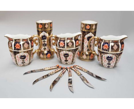 A Set of Three Royal Crown Derby Porcelain Jugs, Imari pattern 1128, printed puce marks, 16cm high, together with a pair of c