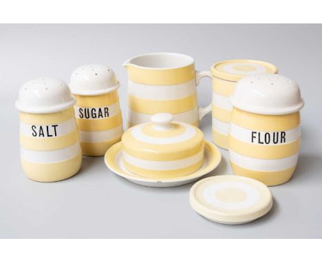 T G Green Cornish Ware, three yellow banded casters "Sugar", "Flour" and "Salt", a butter dish and cover, a cylindrical stora