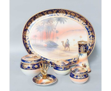 A Noritake Part Dressing Table Set in an Egyptian Pattern including tray, jars and covers, ring hand etc.