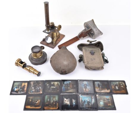An early 20th century brass microscope, slide viewer, coloured Victorian magic lantern slides, a Sun Sculpture viewer and a U