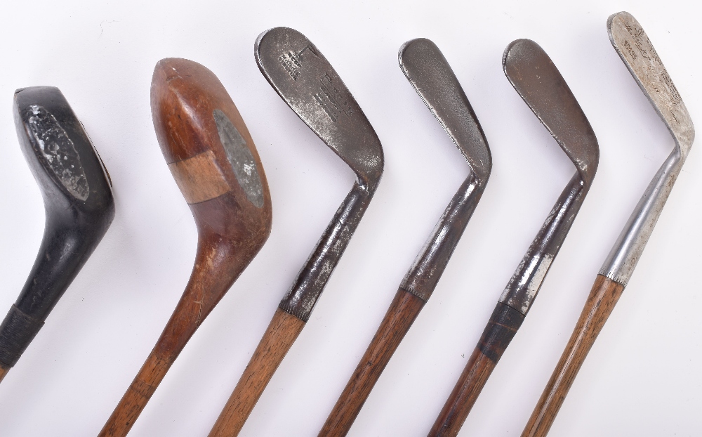 Five vintage wooden handle golf clubs, including an A.Tait Portpatrick