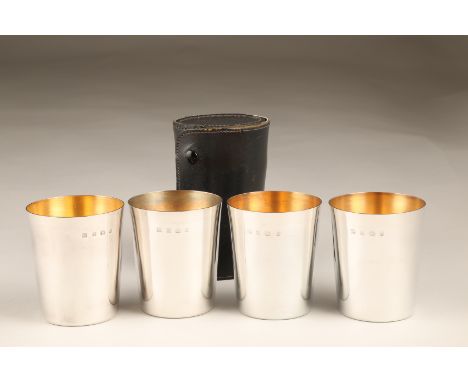 Set of four silver beakers with gilt interiors and leather case, Birmingham 1981. Maker P.H Vogel & Co. 8.5cm high 440g Beake