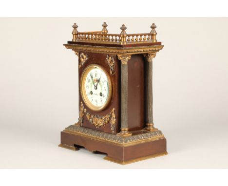 19th century French bronzed and gilt metal mantel clock white enamelled dial, decorated with flowers and butterflies, flanked