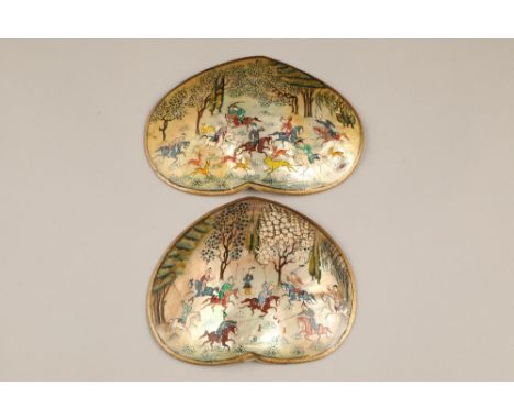 Two Indian mother of pearl shells, one hand painted with men on horseback hunting deer, the other men on horseback playing po