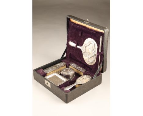 Boxed nine piece Chinese export silver dressing table set which includes, circular trinket dish and cover, button hook, hand 