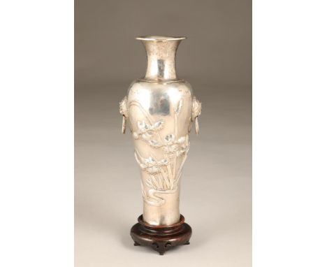 19th/20th century Chinese export white metal vase, balluster form with Chinese lion mask hoop handles, embossed iris flower d