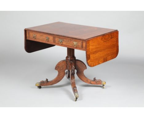 Victorian rosewood dropleaf sofa table with two fitted drawers, central column quadraform legs, terminating in brass casters.