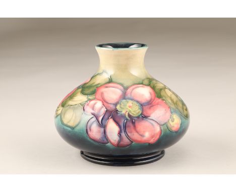 Moorcroft pottery squat vase, anemone pattern, impressed and signed to base. 13cm high The vase is in excellent condition thr