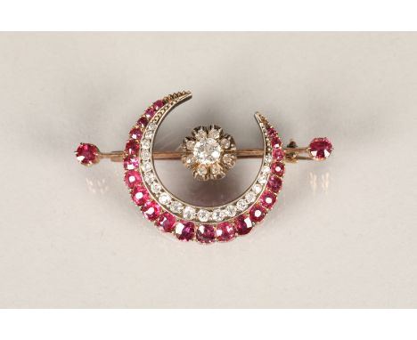 Ladies diamond and ruby crescent brooch, the crescent made up of a double row, the outer row with twenty one oval cut rubies 