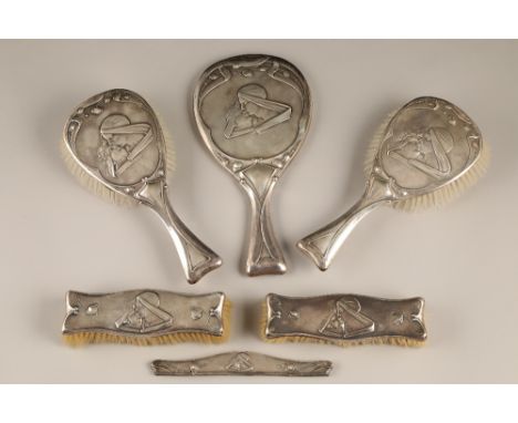 Art Nouveau silver six piece dressing table set, consisting of two pairs of brushes, hand mirror and a comb holder, decorated