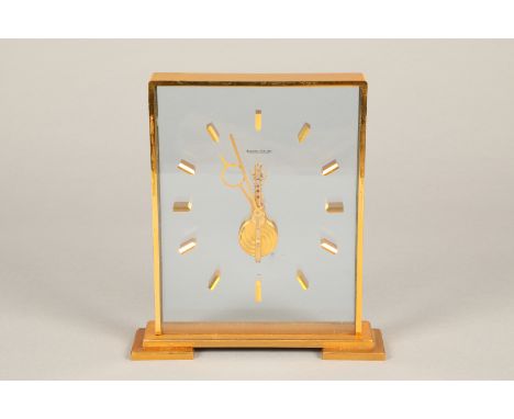 A Jaeger-Le-Coultre brushed gilt framed rectangular floating skeleton clock with visible jewelled Swiss movement. 20cm high T