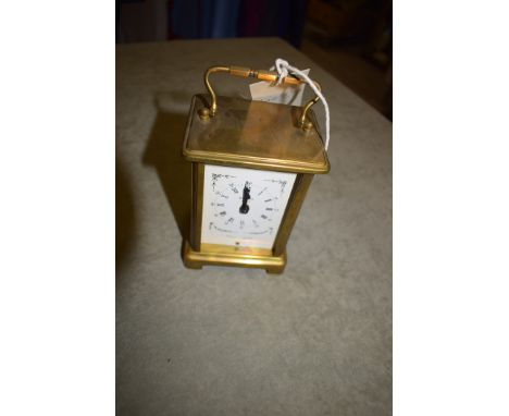 A Bayard Parisian brass cased carriage clock with white enamel roman dial.