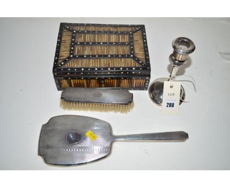 A silver candlestick; a silver backed hand mirror and clothes brush; and a porcupine quill box.