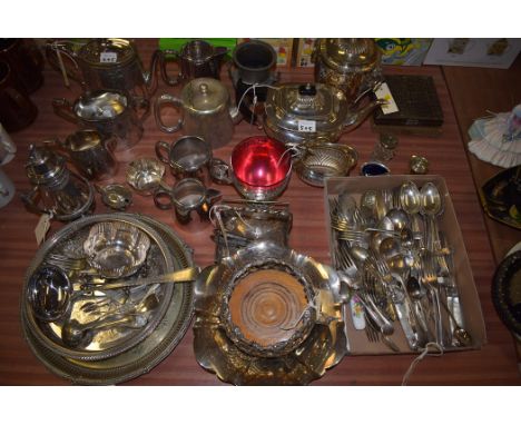 A quantity of silver plated ware to include; a three piece tea service; circular trays a biscuit barrel; flatware; etc.